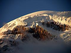 Ecuador Chimborazo 02-05 Estrella del Chimborazo Chimborazo Whymper Route Close Up At Sunset Here�s a close up of the rock band and the glaciers of the Ventimilla (6267m) summit of Chimborazo at sunset viewed from the Estrella del Chimborazo.